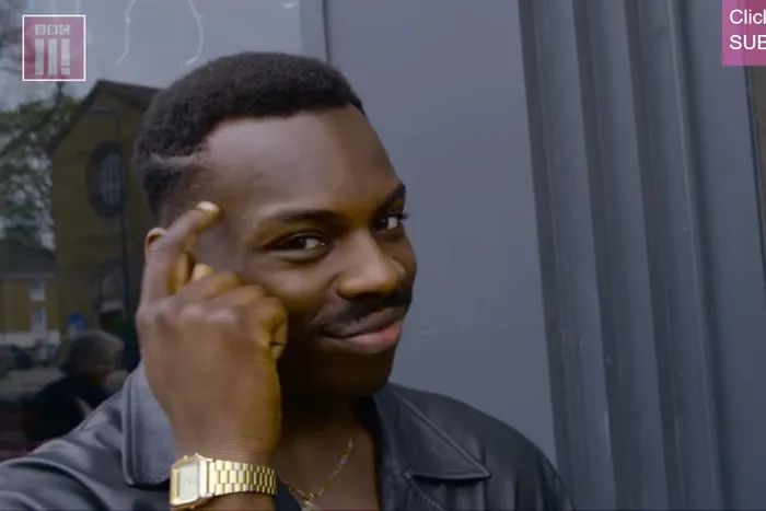 Guy tapping his head meme.