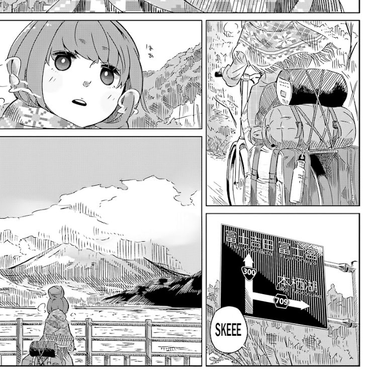 First panels of the manga Laid-Back Camp. Girl with a bike loaded with camping gear views Mt Fuji obscured by clouds.