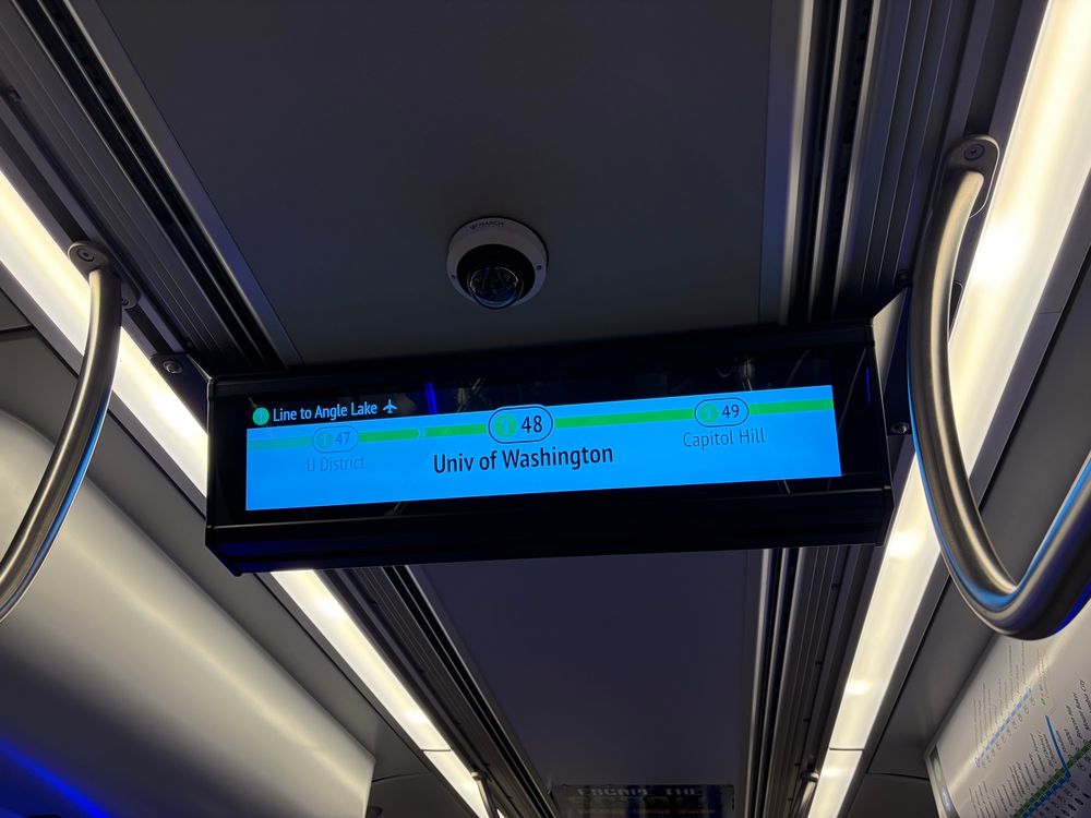 On board display indicating next station on the Link 1 Line to Angle Lake and Airport is number 48, University of Washington, then 49, Capitol Hill.