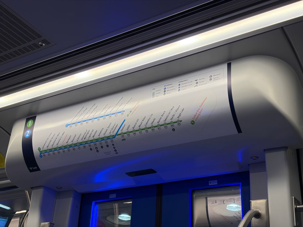Link light rail system diagram showing 1 and 2 lines with station numbers above door inside train
