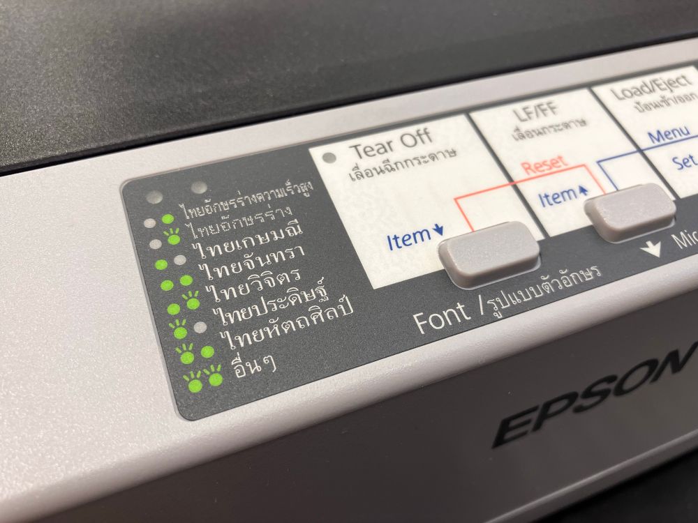 Font indicator and paper feed controls on Epson dot matrix printer