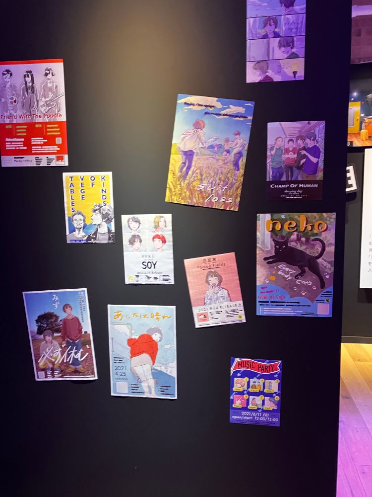 Band posters parodying real Japanese bands inside fictional Starry live house