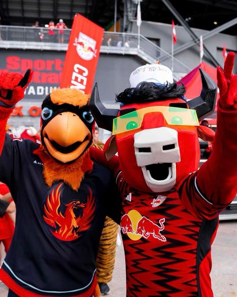 Fuego taking a photo with REDD at a New York Red Bulls game during REDD’s Birthday Bash. 