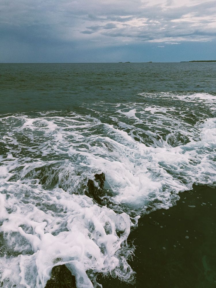 Waves crashing on a beach in Siargao