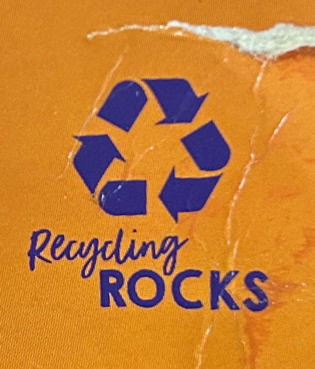 There is a recycling logo on a box, and under it it reads “recycling rocks”