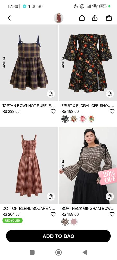 Quanto mais longe eu ia rolando, mais diferente iam ficando, aqui tem um vestido bem curto, rotado, sem quase nada de marcação na cintura, mas lindo também. E começou a aparecer blusas também.