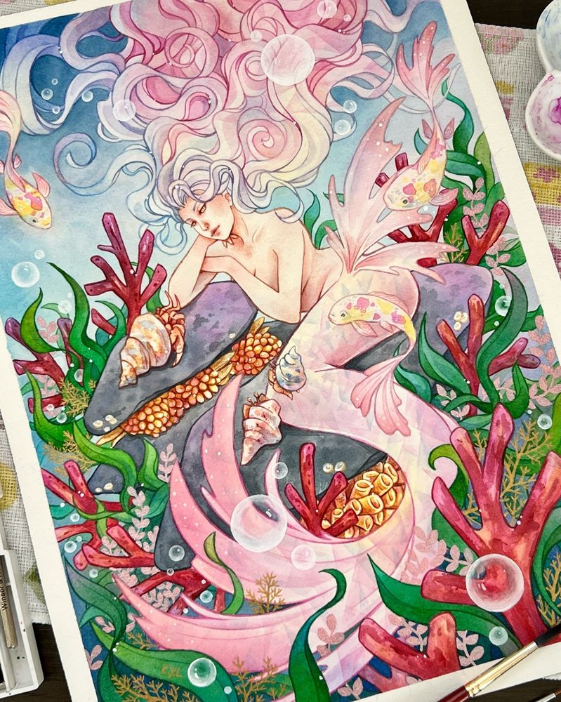 A pink mermaid with long flowing hair, sitting relaxed on a rock, surrounded but fish, crabs, coral and seaweed and listening intently to a hermit crab.