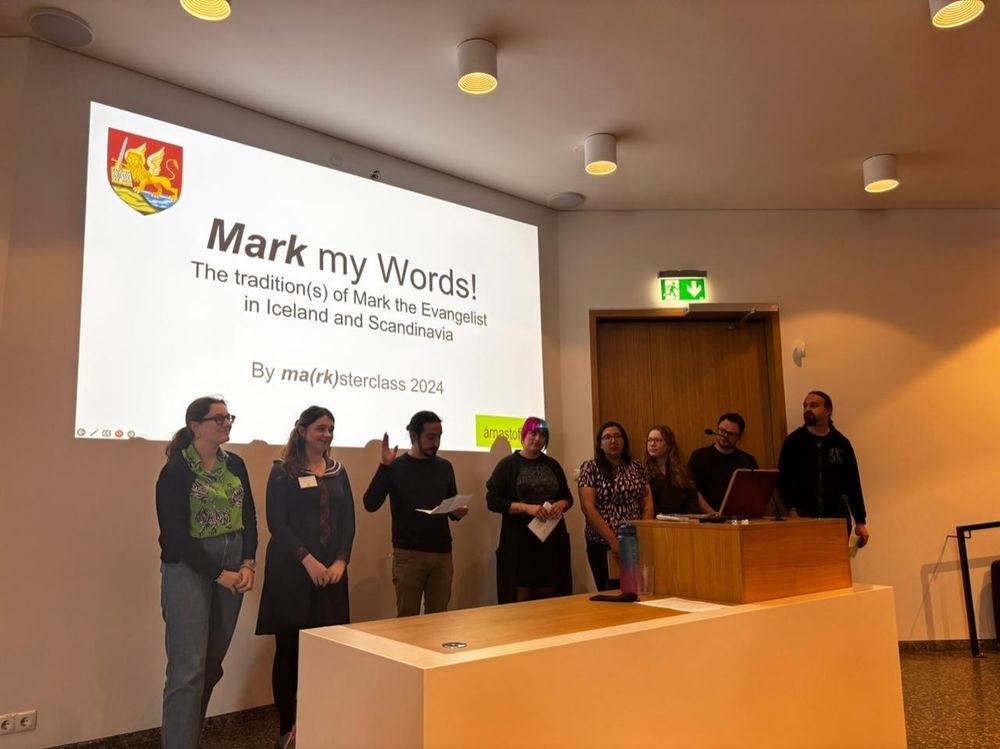 The Master Class attendees are stood in front of the title slide 'Mark my Words: The Tradition(s) of Mark the Evangelist in Iceland and Scandinavia'