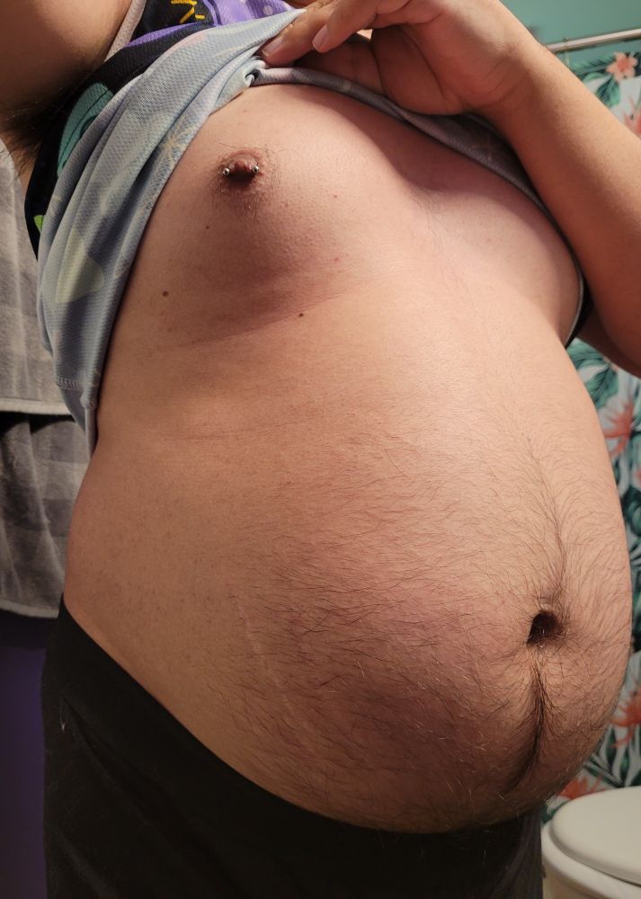 Photo of me lifting my shirt up and showing my belly and moob, with a nipple piercing