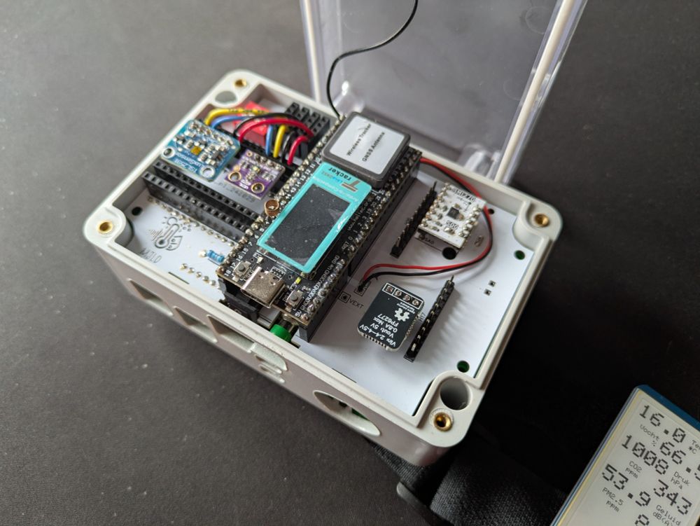 Photo of a sensor box that has been opened, with LabCrafter's 5V boost converter visible on the bottom right of the board.