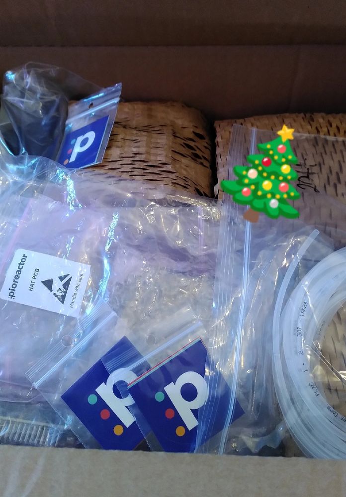 Shipping box containing a variety of Pioreactor parts 