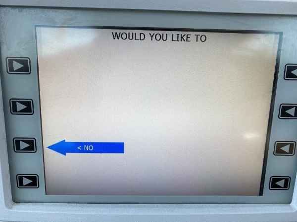 An ATM screen with the heading "Would You Like To," above the the space where descriptions for selectable actions would usually be displayed in line with the selector buttons. There is only one visible option, and it's just a big blue arrow labeled NO, with zero explanation or other text.