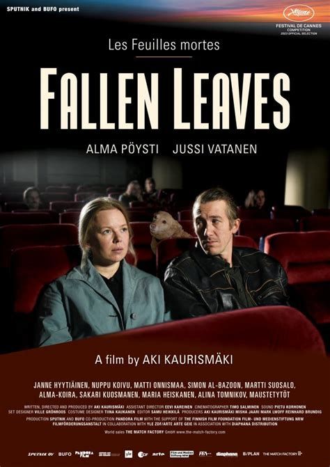 Film poster with Fallen Leaves written in large white letters against a dark background. Beneath the title are two people sat in a cinema. The man is looking sideways towards the woman who assists to be looking at the screen. Smaller writing says A film by AKI KAURISMÃKI