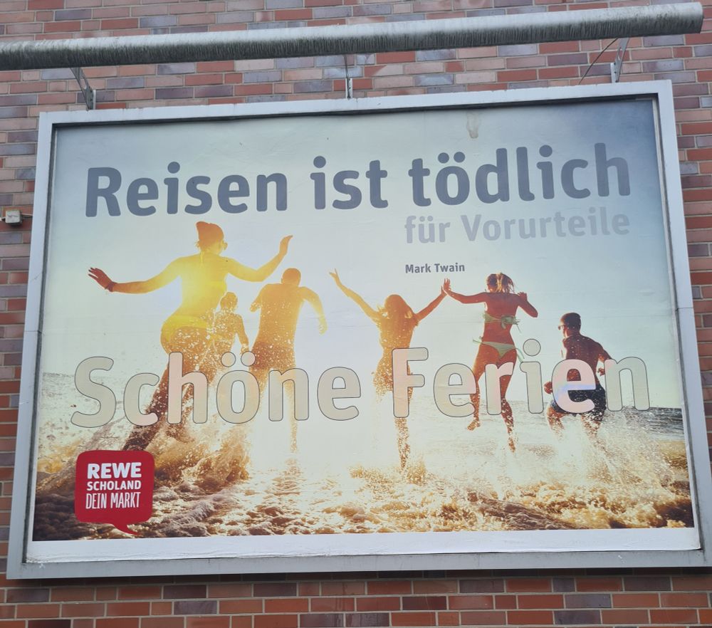 Werbung vom lokalen REWE: Reisen ist tödlich...für Vorurteile! (Mark Twain) - Schöne Ferien.