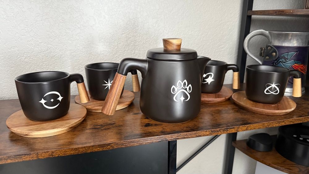 Furality Somna tea set, in black matte ceramic, with Somna themed white engraving.