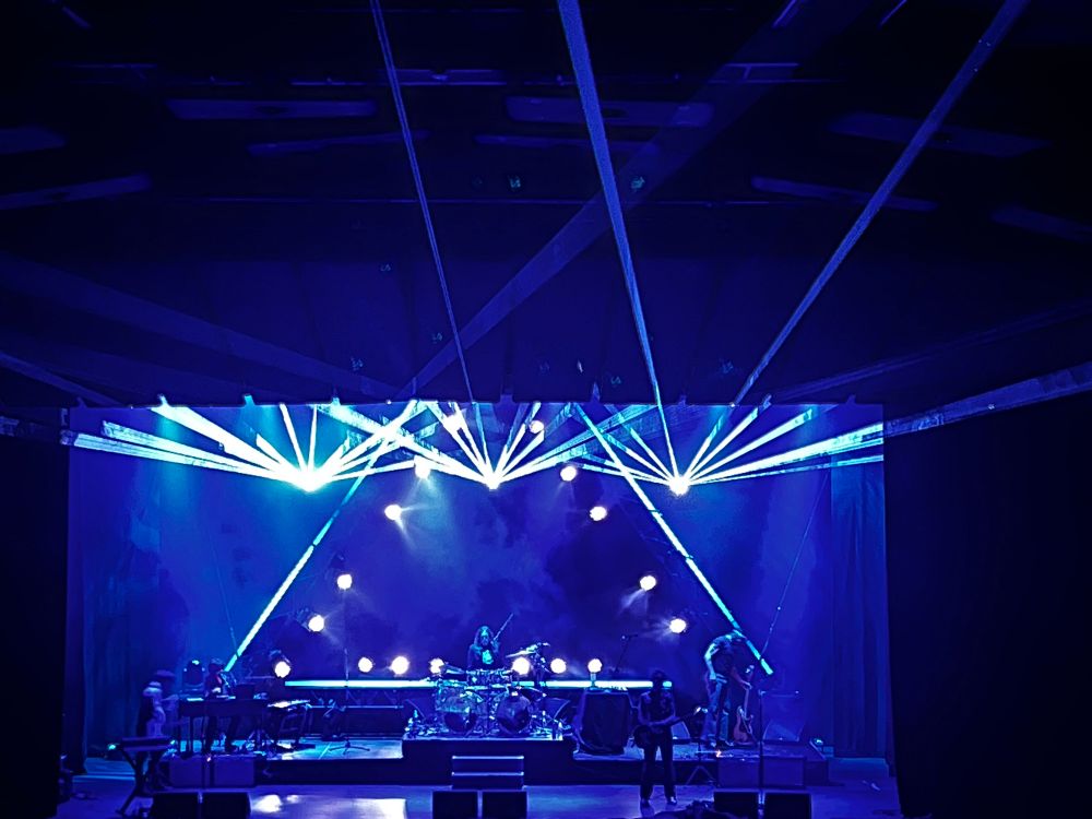 ARC onstage at Canberra theatre under laser lights