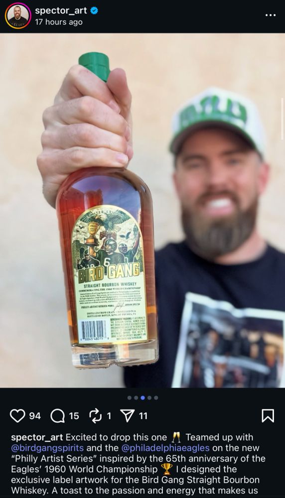 Jordan Spector holding a bottle of Bird Gang whiskey