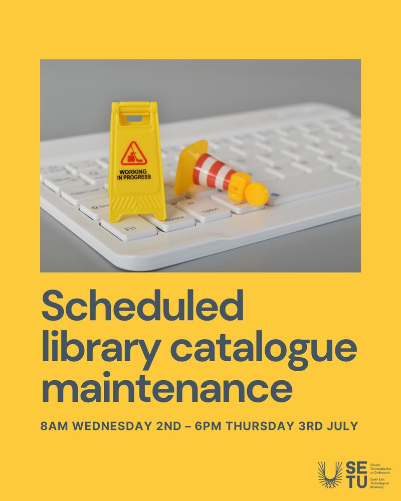 A yellow background with a photo of a white computer keyboard. On the keyboard are two miniature props: a yellow caution sign that reads "Working in Progress" and a small striped traffic cone. Below the photo, bold blue text reads: "Scheduled library catalogue maintenance. 8am Wednesday 2nd – 6pm Thursday 3rd July." In the bottom right corner is the South East Technological University (SETU) logo.