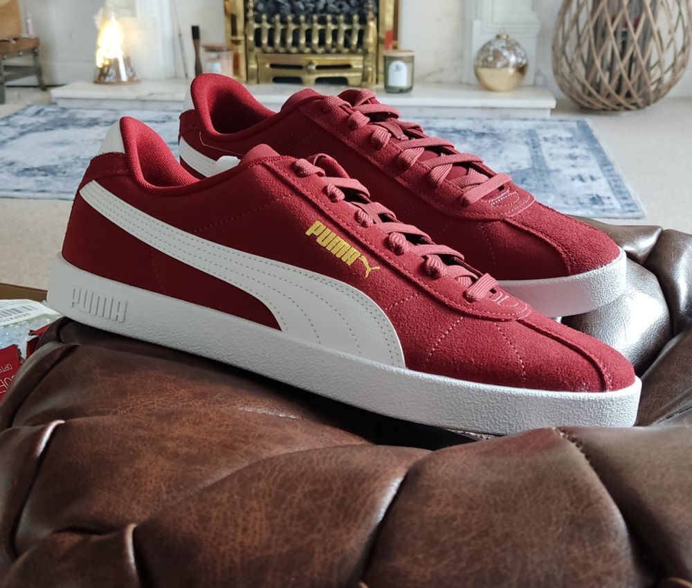 Picture of new, red, puma trainers.