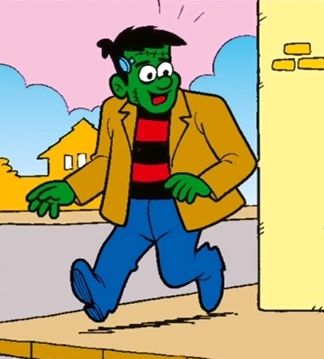 Frank, da aTurma do Penadinho. Ele é verde, usa calça e sapatos azuis, terno bege e camiseta com listras horizontais pretas e vermelhas