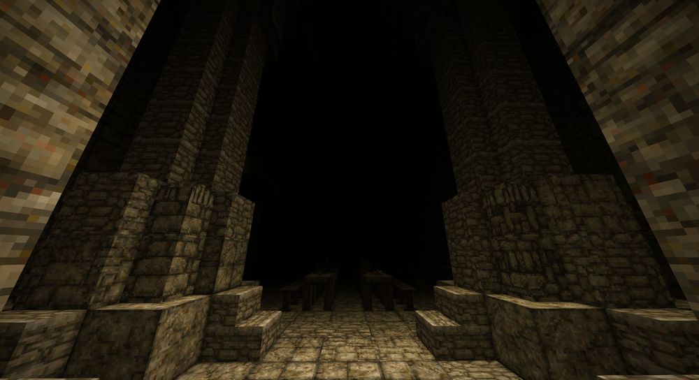 Two pillars in the darkness, seemingly stretching up into nothingness.