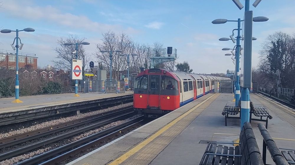 Piccadilly line train (front) speeding through turnham green