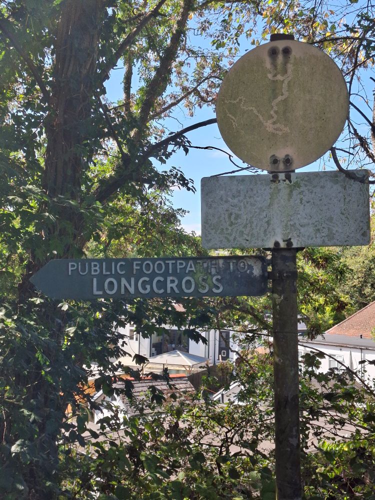 Clear footpath sign, Longcross, with completely faded road signs.
Snail feeding trails on the road signs.
Near Virginia Water. 