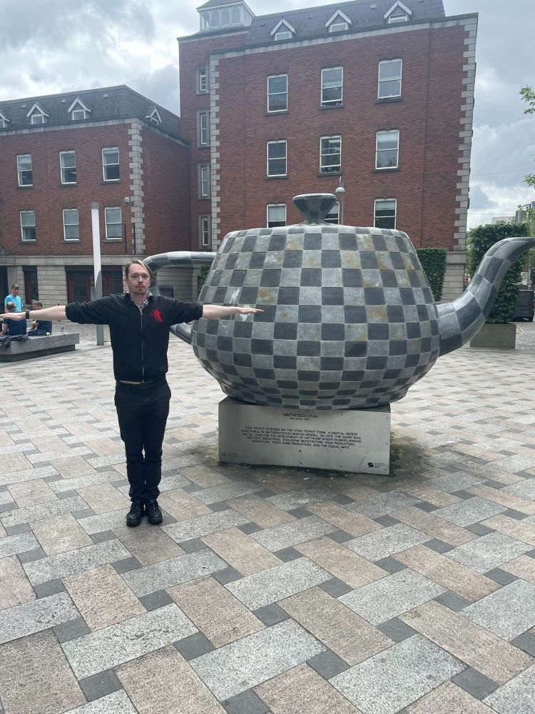 Me T posing in front of a real life giant untextured Utah teapot