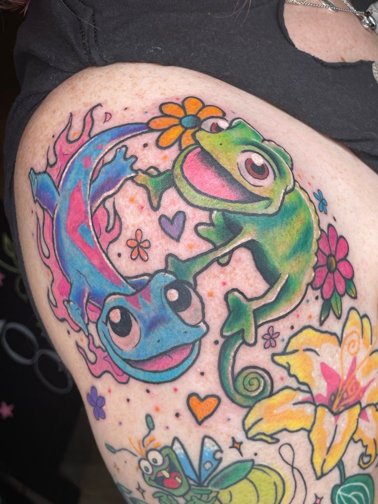 Tattoo of Frozen’s Bruni and Tangled’s Pascal in a yin-yang shape on a shoulder cap