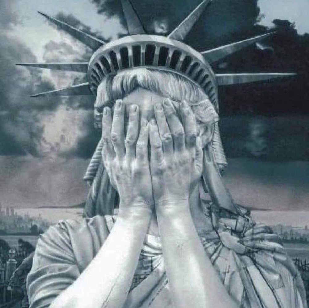 Statue of Liberty covering her face with her hands while crying.