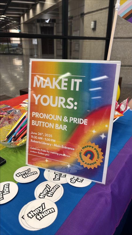 Image of a poster saying make it yours pride button bar with rainbows in the background