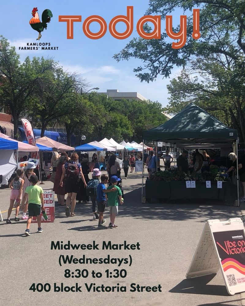 A photo of market on July 16th, 2025 showing a group of people entering the market from the west end entrance.   The Vibe on Victoria sign is visible on the right. Text on the image says, “Today! Midweek Market (Wednesdays), 8:30 to 1:30, 400 block Victoria Street.” The KFM rooster logo is in the upper left corner.