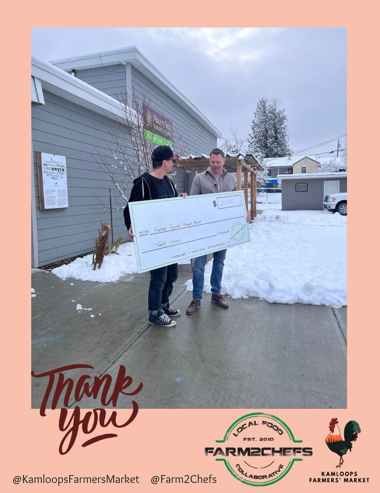 A photo of Greg Unger, Market Manager, and Jared Summers, Farm2Chefs President, stand holding a large cheque being presented to the Kamloops Farmers’ Market as the Farm2Chefs’ 2025 recipient organization.  Text on the graphic says, “Thank you.” Meta social media tags and logos for both organizations are at the bottom. 