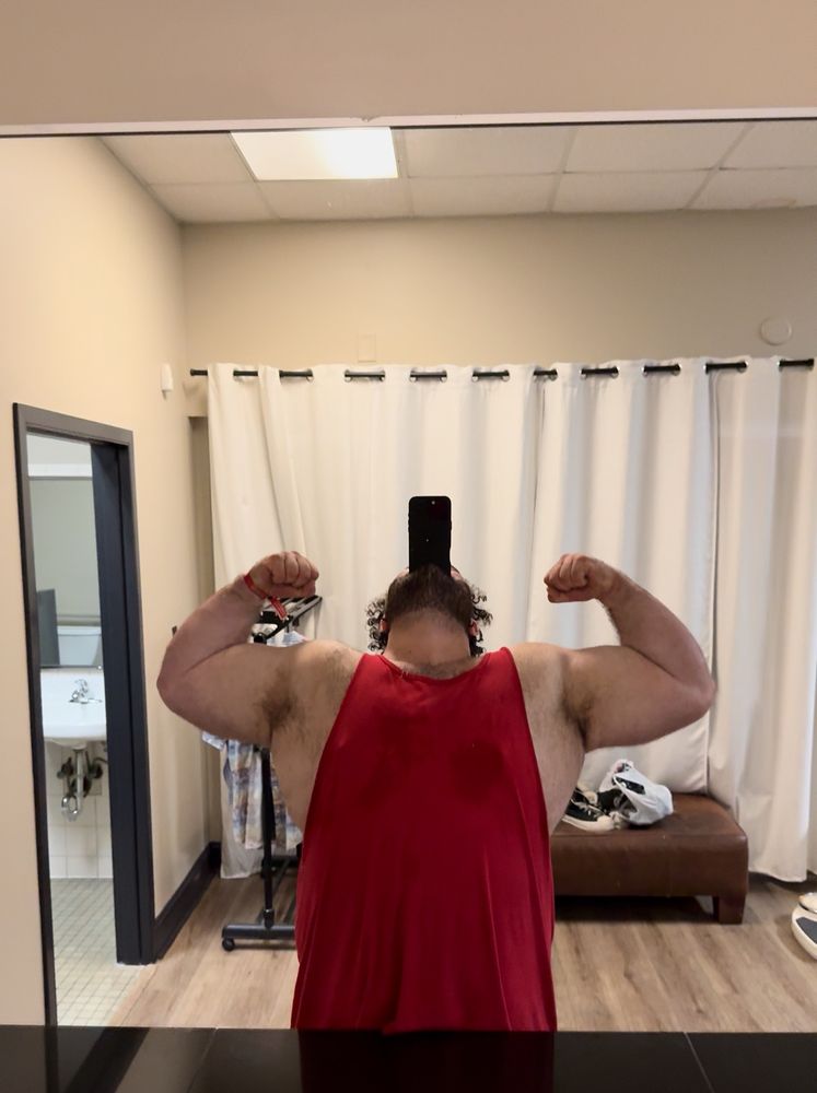 From the end of the workout using the phone is his mouth for a brovine to his a double bicep flex.