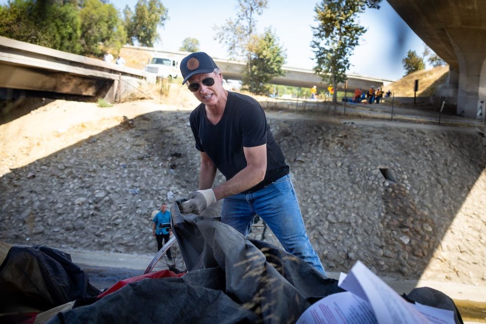Gavin Newsome participating in the removal of homeless encampments