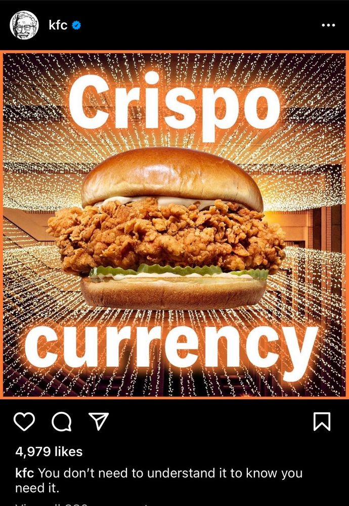 Image of a KFC burger with the text “crispo currency” on display