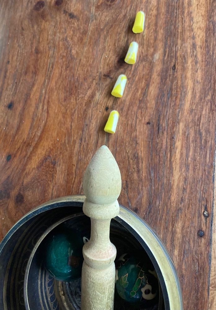 Same image from the first, with the added bonus of four ear plugs lined up to make the wooden thing look like it’s jizzing. I know, it should be a word in the dictionary. 