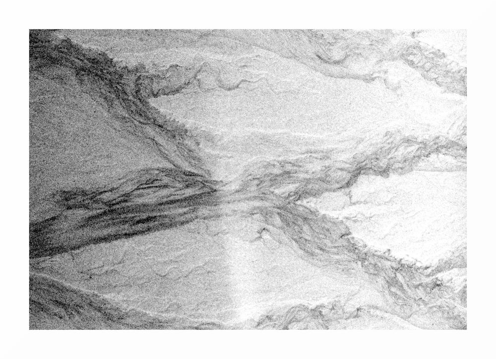 black & white image of streaks in sand caused by tiny rivulets of water, in an X pattern