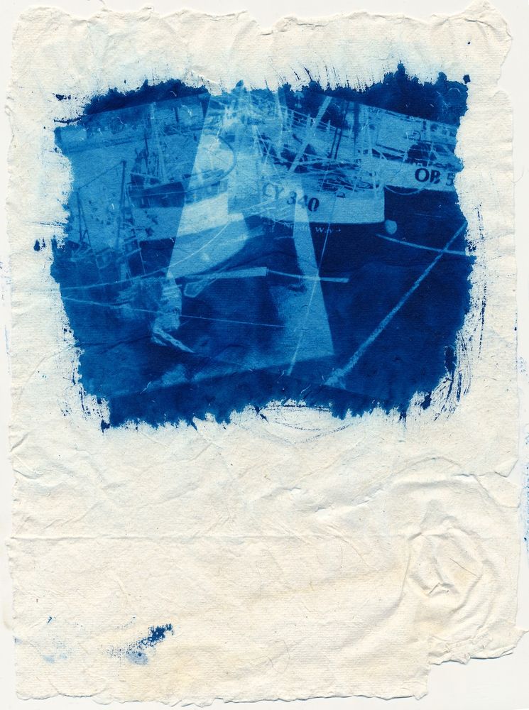 cyanotype. hand made paper, roughly 20 grams weight. A double exposure of fishing boats in harbour.