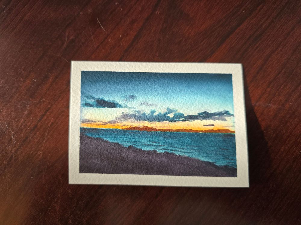 Art card watercolor depicting a twilight sunset over Galway Bay and the distant mountains of Connemara as seen from the Aran Island of Inis Oírr.