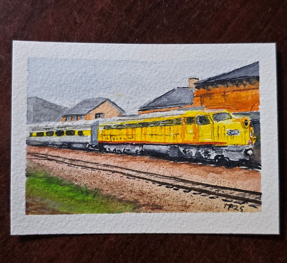 Art card watercolor painting of an EMD E8A railroad engine and coach car, MILW 35A, on static display at the Madison station in Madison. WI.