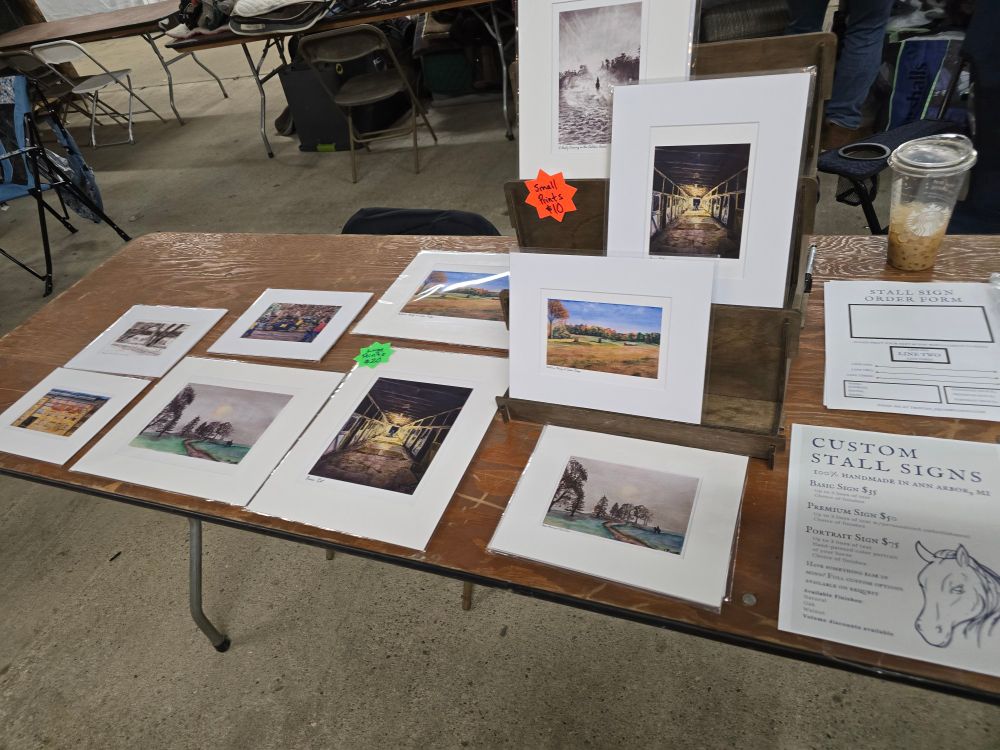 Booth display highlighting art prints
