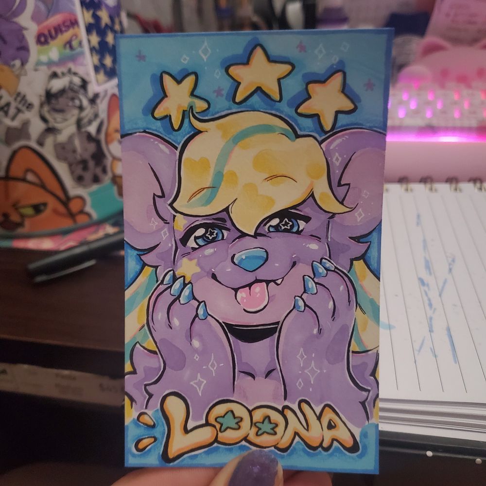 Cute character badge of a purple and lavander OC with a cute tongue smile, the name is Loona. Little stars throughout 