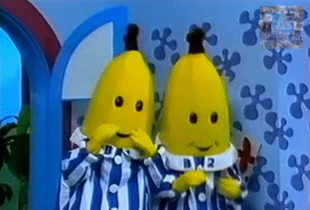 two bananas are standing next to each other wearing pajamas and a collar that says d.j.2