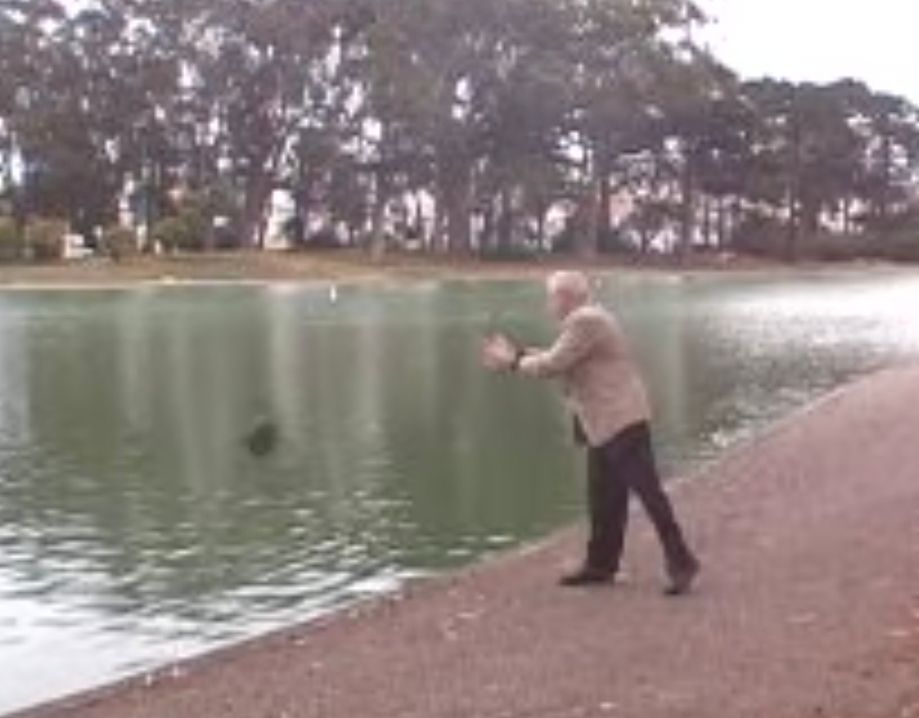 Mike Gravel throws a rock into a pond in 2007 for a campaign ad