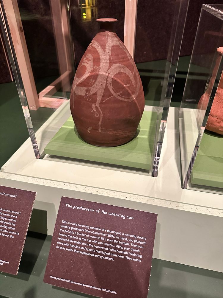 Label and object displayed in glass case.