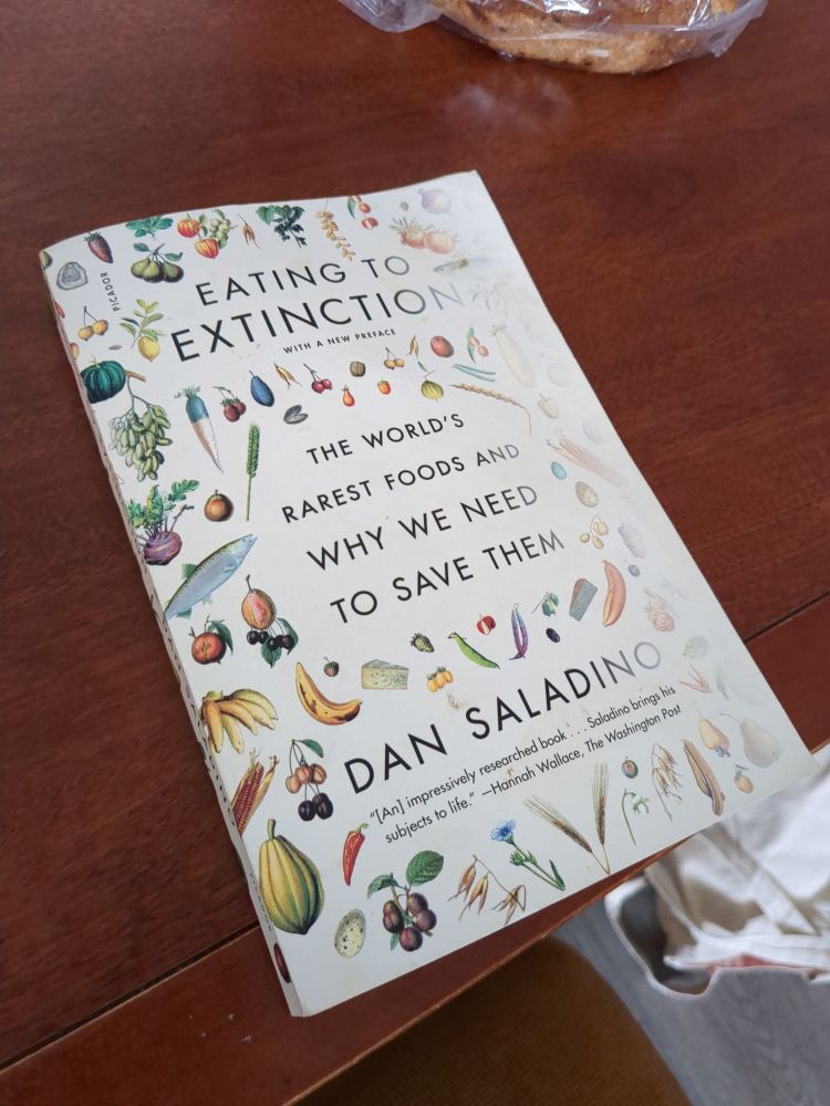 A copy of "Eating to Extinction" by Dan Saladino