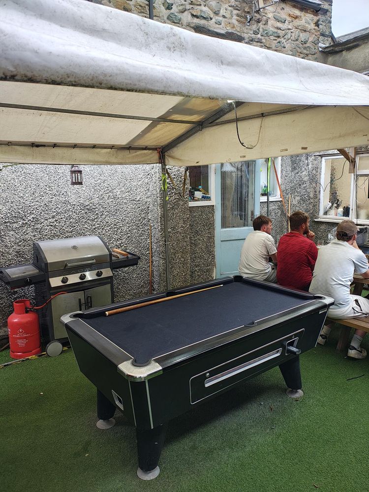 A pool table in a beer garden