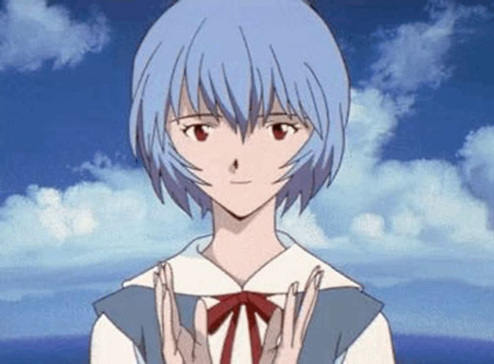 a girl with blue hair is giving the peace sign with her hands .