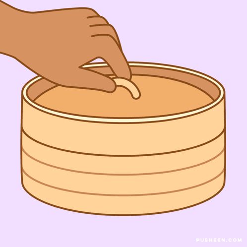 a cartoon of a person putting a dumpling in a bamboo steamer